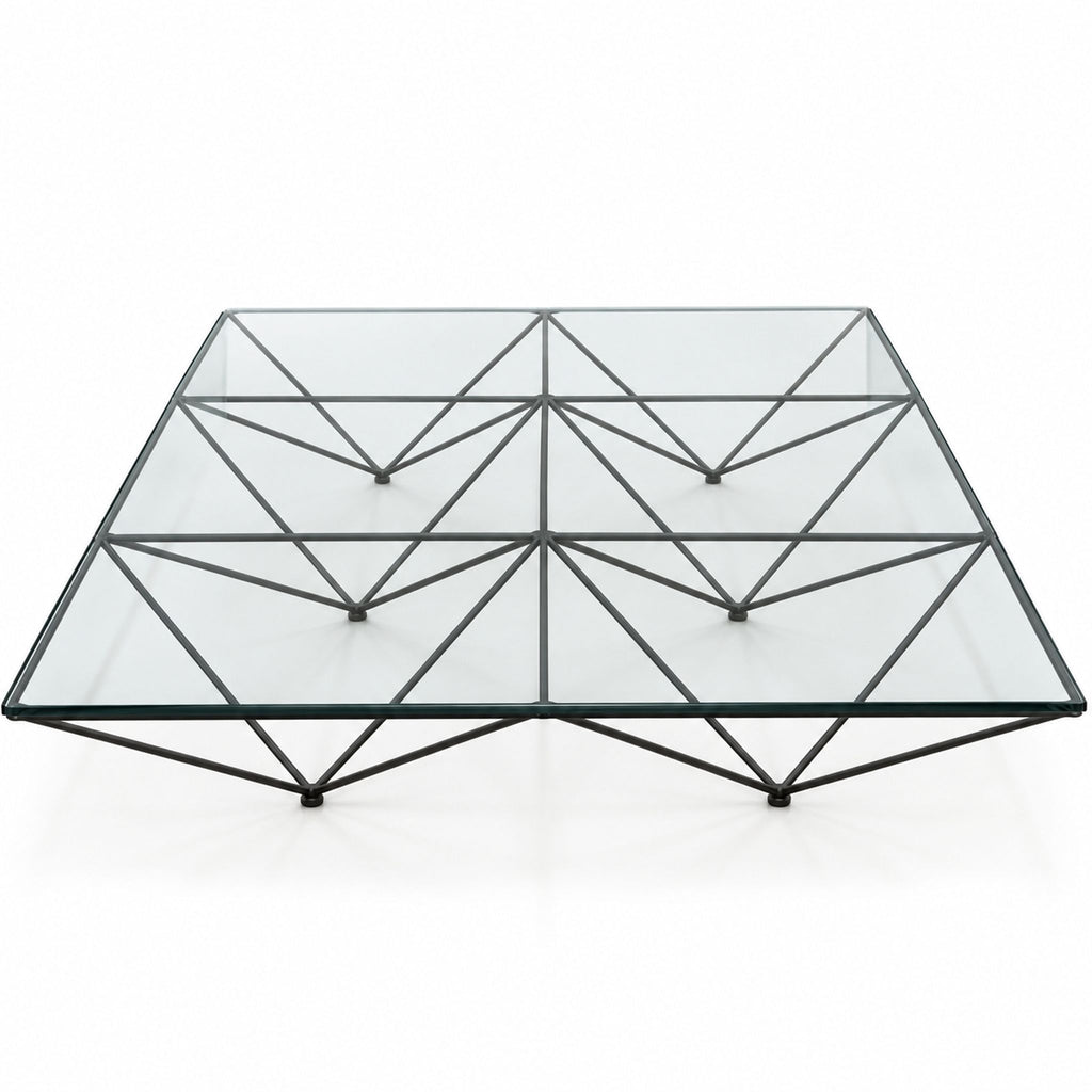 3. High-end $7000 coffee table by Paolo Piva, clear glass and geometric metal base, perfect for modern interiors.