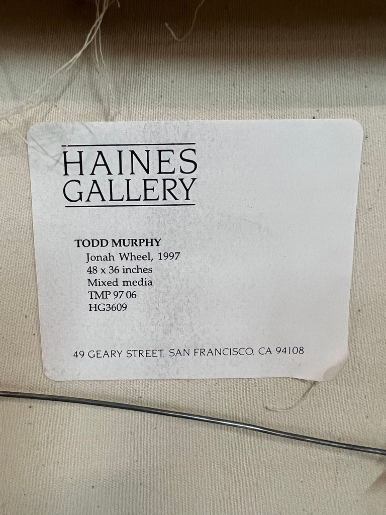 Gallery label for Todd Murphy's mixed media artwork, "Jonah Wheel", displayed at Haines Gallery.