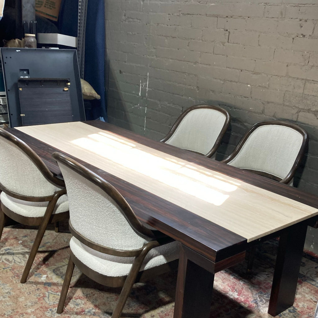 3. Angled view of a Reperch dining set featuring four chairs and a marble inlay table, next to a brick wall.