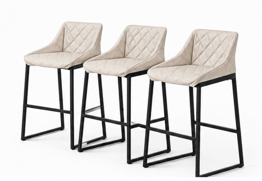 Pair of high-end Kekke stools from Piet Boon; slim metal legs support cushioned seats, ideal for contemporary bars.