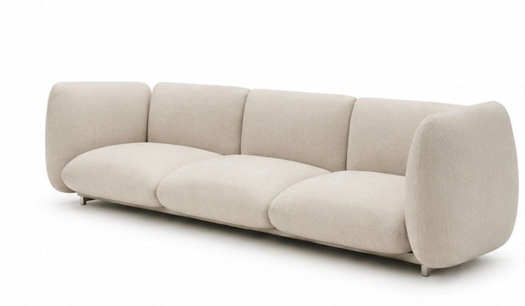 Contemporary Paola Lenti sectional from 2015, featuring soft curves and modular seating in neutral tones.