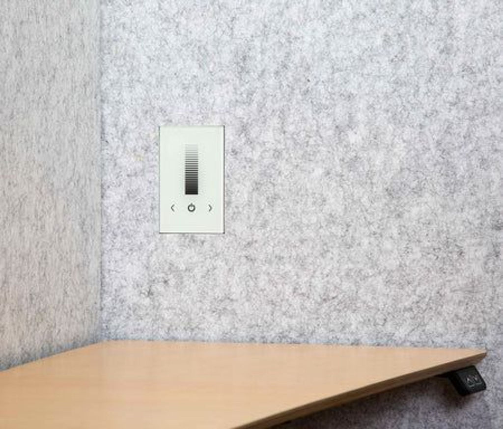 a white light switch on a wall