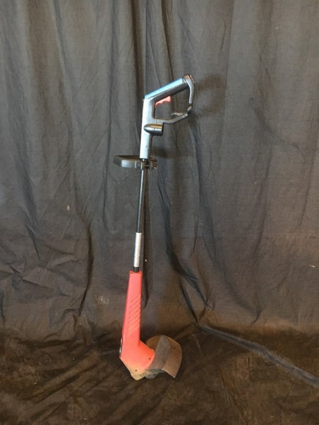 1. Toro electric 11" wire trimmer/edger tool with ergonomic handle and red body, displayed against a dark backdrop.  