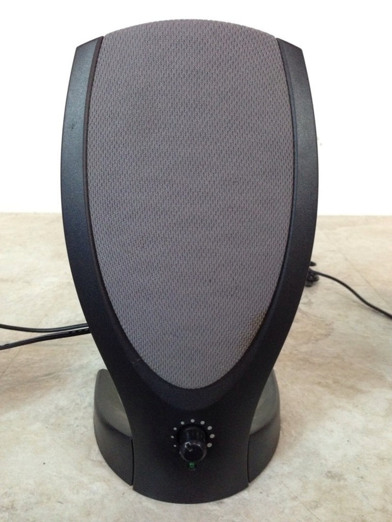 3. Harman/Kardon audio speaker with front control knob, power cord and headphone cord partially visible behind.