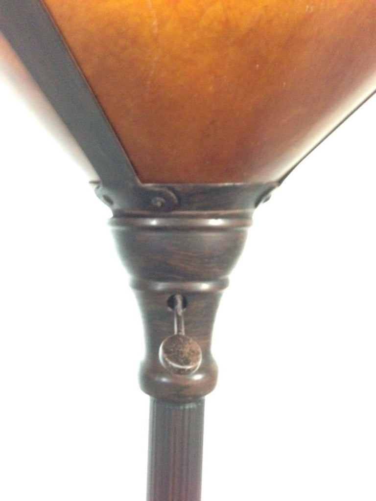 3. Detailed view of the upper section of a Reperch floor lamp, highlighting the amber shade and vintage pull chain.