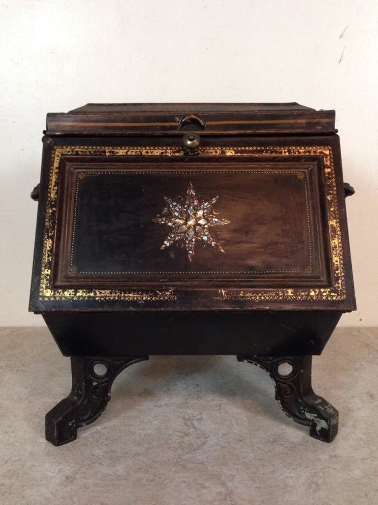 2. Vintage Reperch trunk featuring abstract star inlays, gold detailing, sturdy handles, and angled legs.