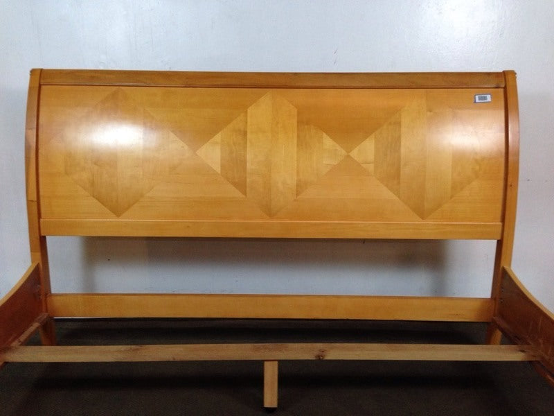 3. Close-up of a Reperch bed headboard, showing prominent geometric diamond motif.
