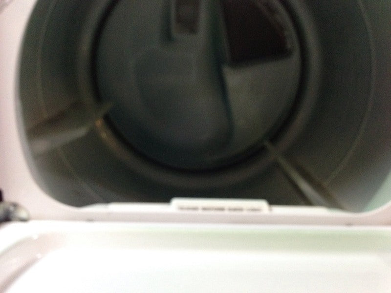 3. Interior drum view of a Kenmore dryer, highlighting the spacious design and lint filter inside the appliance.