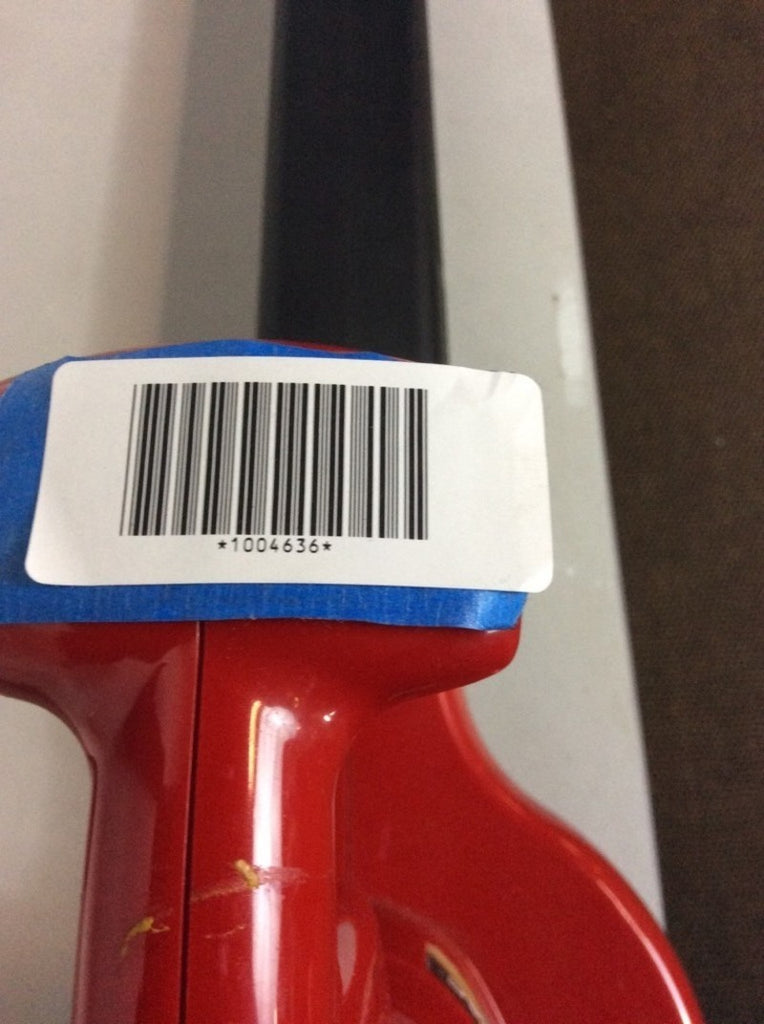 3. Close-up of Toro Ultra Blower Vac handle showing a blue tape and barcode labeled 1004636.