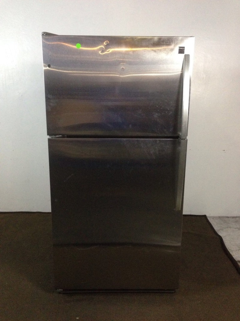 1. Stainless steel Kenmore refrigerator with a top freezer and flat doors, shown closed against a white wall.