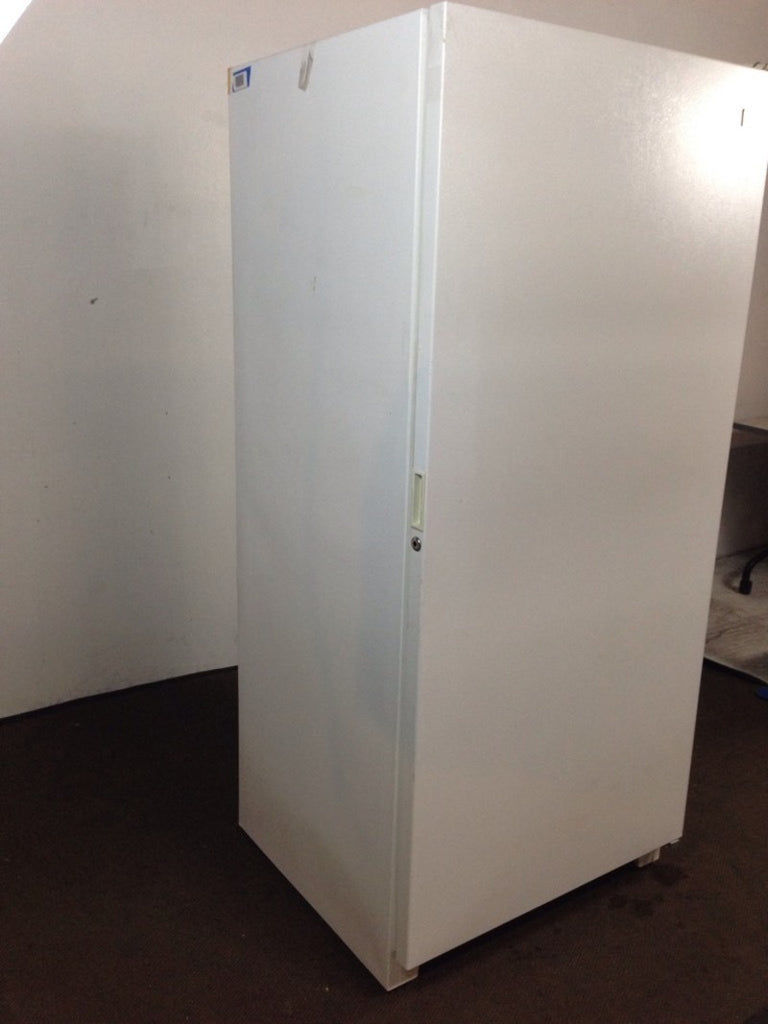 2. Angled side view of a white Kenmore Frostless refrigerator, showing its simple and clean lines.