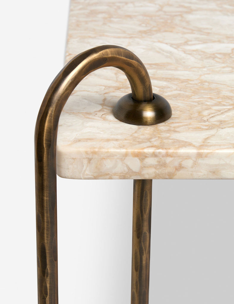 a brass table with a brass handle