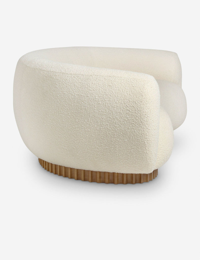 3. Close-up of the Reperch 3-seat sofa’s end, showing plush curved upholstery and wooden base details.