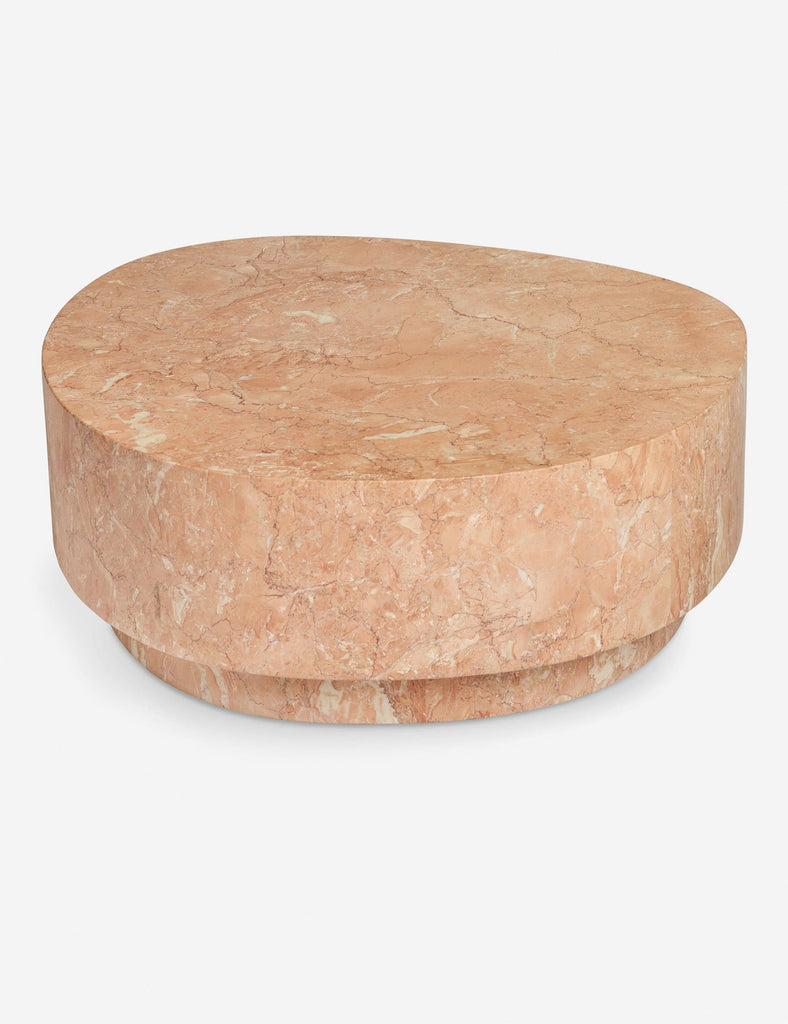 Reperch coffee table with an organic, round shape and polished marble finish in warm pink tones.  
