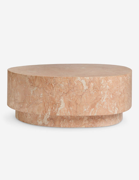 Round pink marble coffee table from Reperch, featuring a smooth, natural stone pattern.  