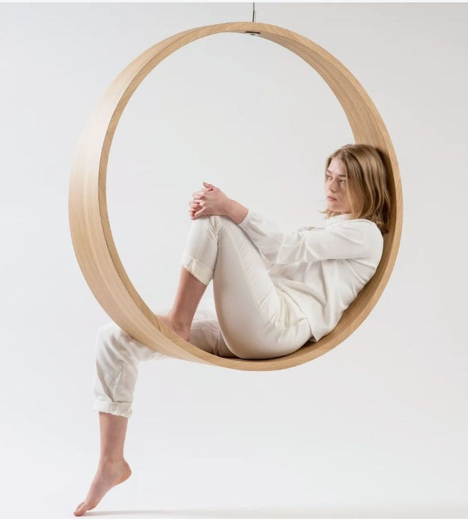 the chair is made of wood and is made from a single piece of wood.