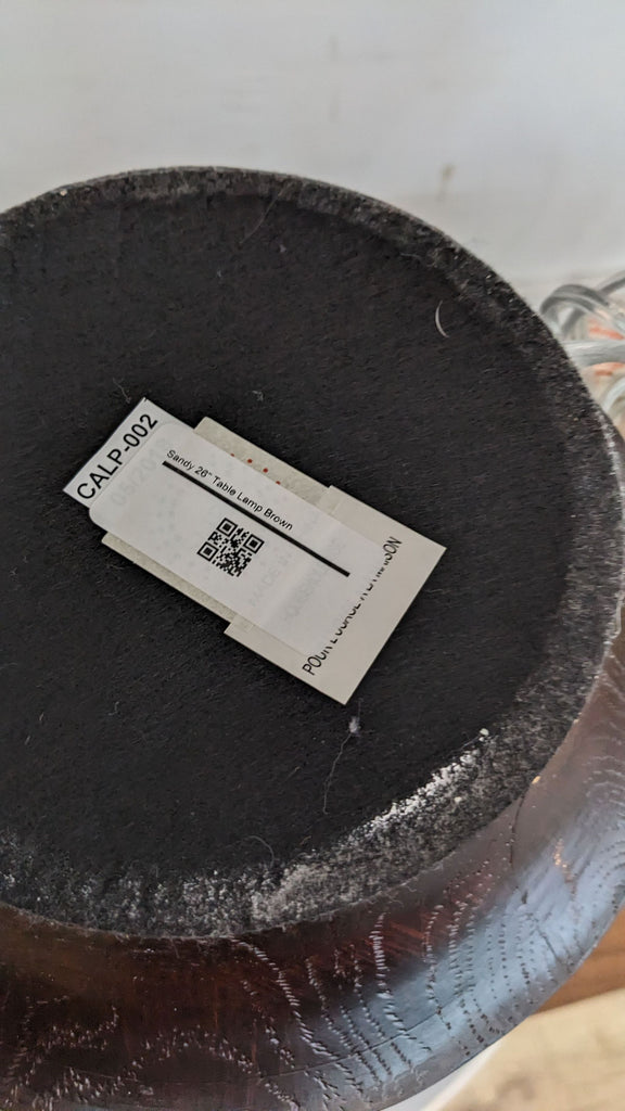 Bottom view of the Reperch lamp showing a label with product details.