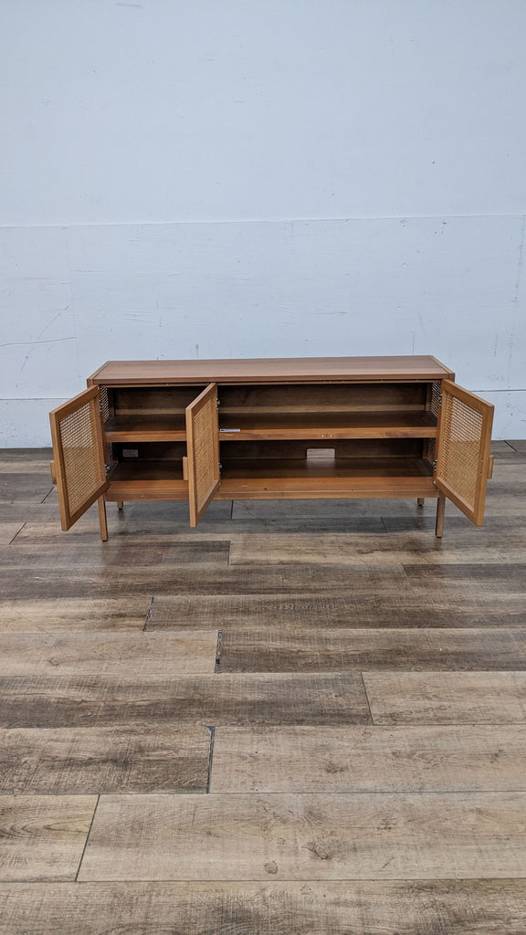 Open view of TV stand showing fixed shelves and storage space.