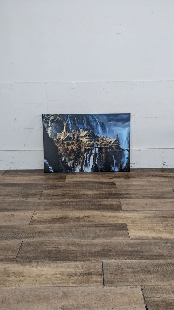 Rivendell Waterfalls art print on canvas, leaning against a wall.