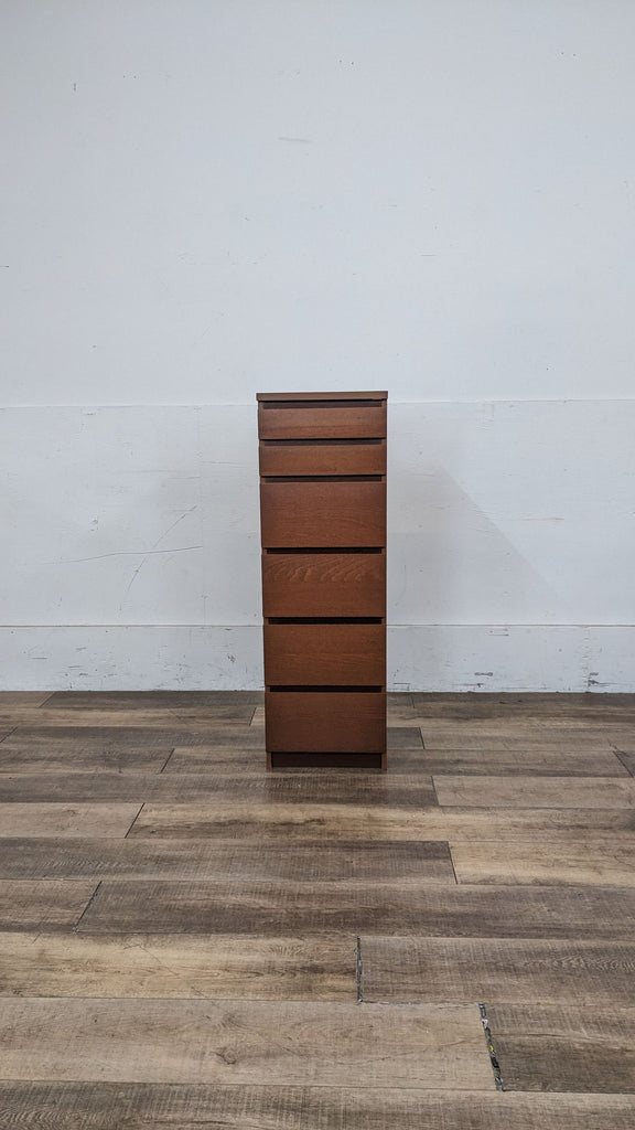 IKEA Malm dresser with 6 drawers in a wooden finish.  