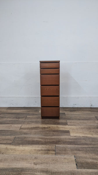 IKEA Malm dresser with 6 drawers in a wooden finish.  