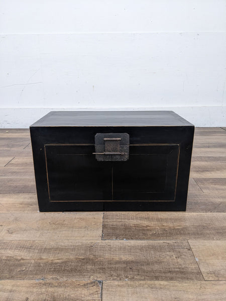 a late 19th century black lacquer chest with brass hardware.