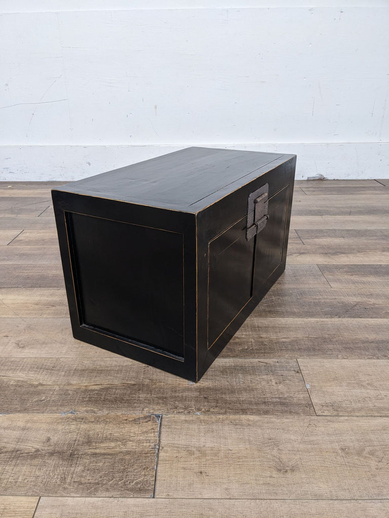 a vintage black lacquer coffee table in the style of [ unused0 ]