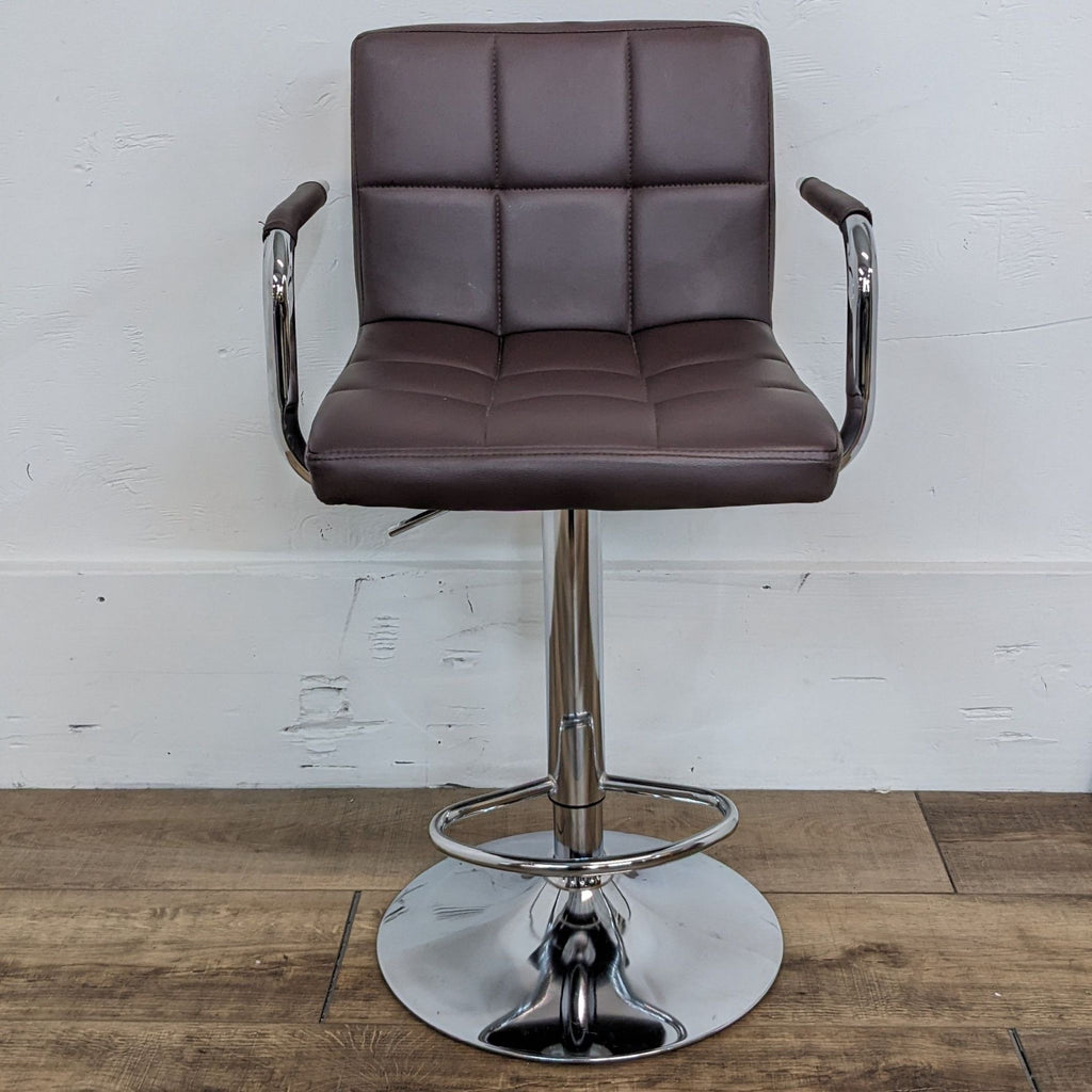 Brown leather look swivel stool with arms, chrome base, front view.