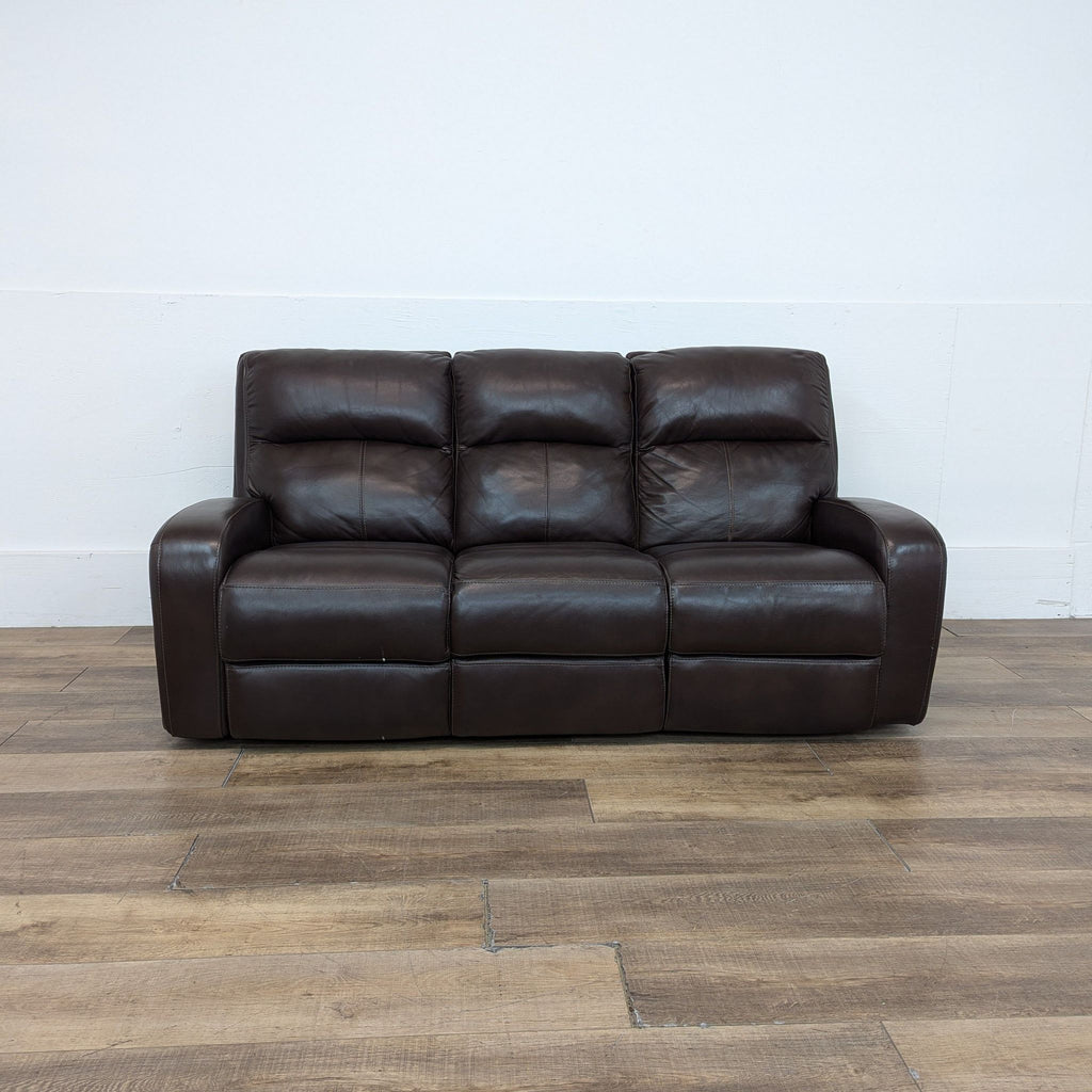 the sofa is a leather sofa that is made from a single piece of leather.