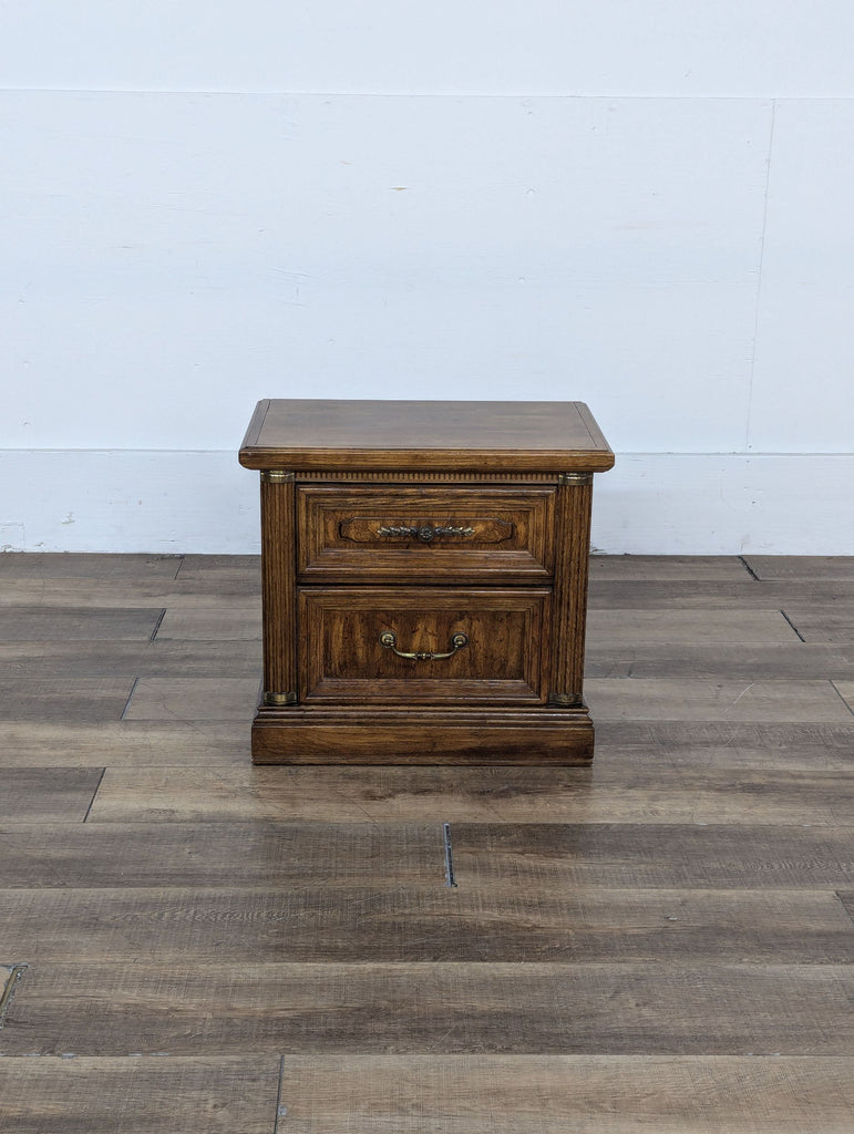 a vintage mid century oak bedside table