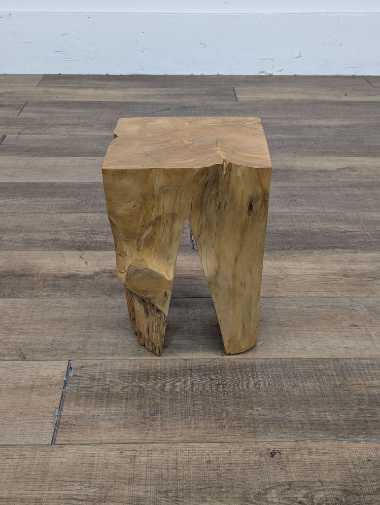 the [ unused0 ] stool is made from a solid wood slab.