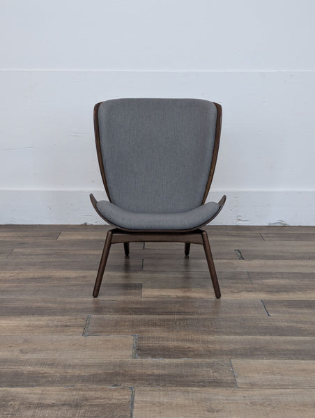 a chair is sitting on a floor in a room 