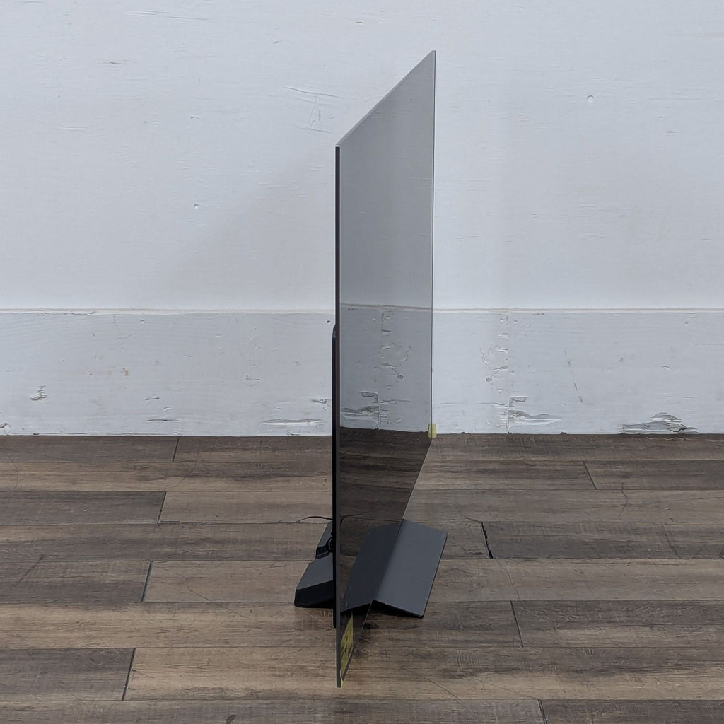 a small white mirror sitting on a floor 