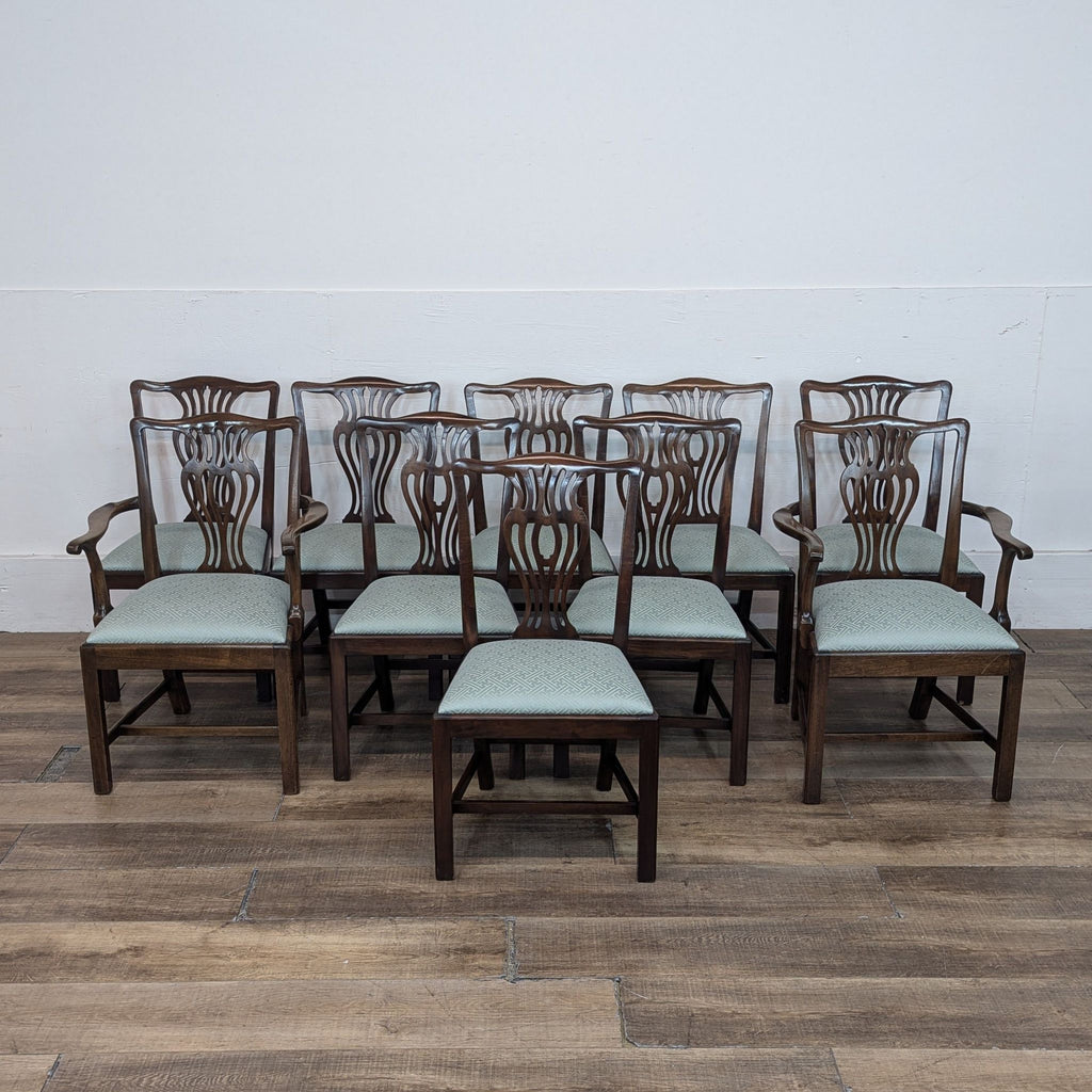 Set of 10 George III style mahogany dining chairs, including 2 with armrests, on wooden floor.  