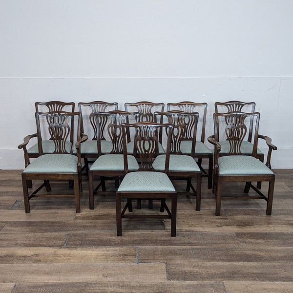 Set of 10 George III style mahogany dining chairs, including 2 with armrests, on wooden floor.  