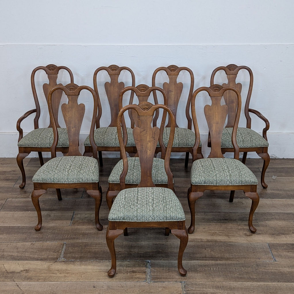 Set of Drexel Heritage dining chairs with wooden frames and patterned green cushions.