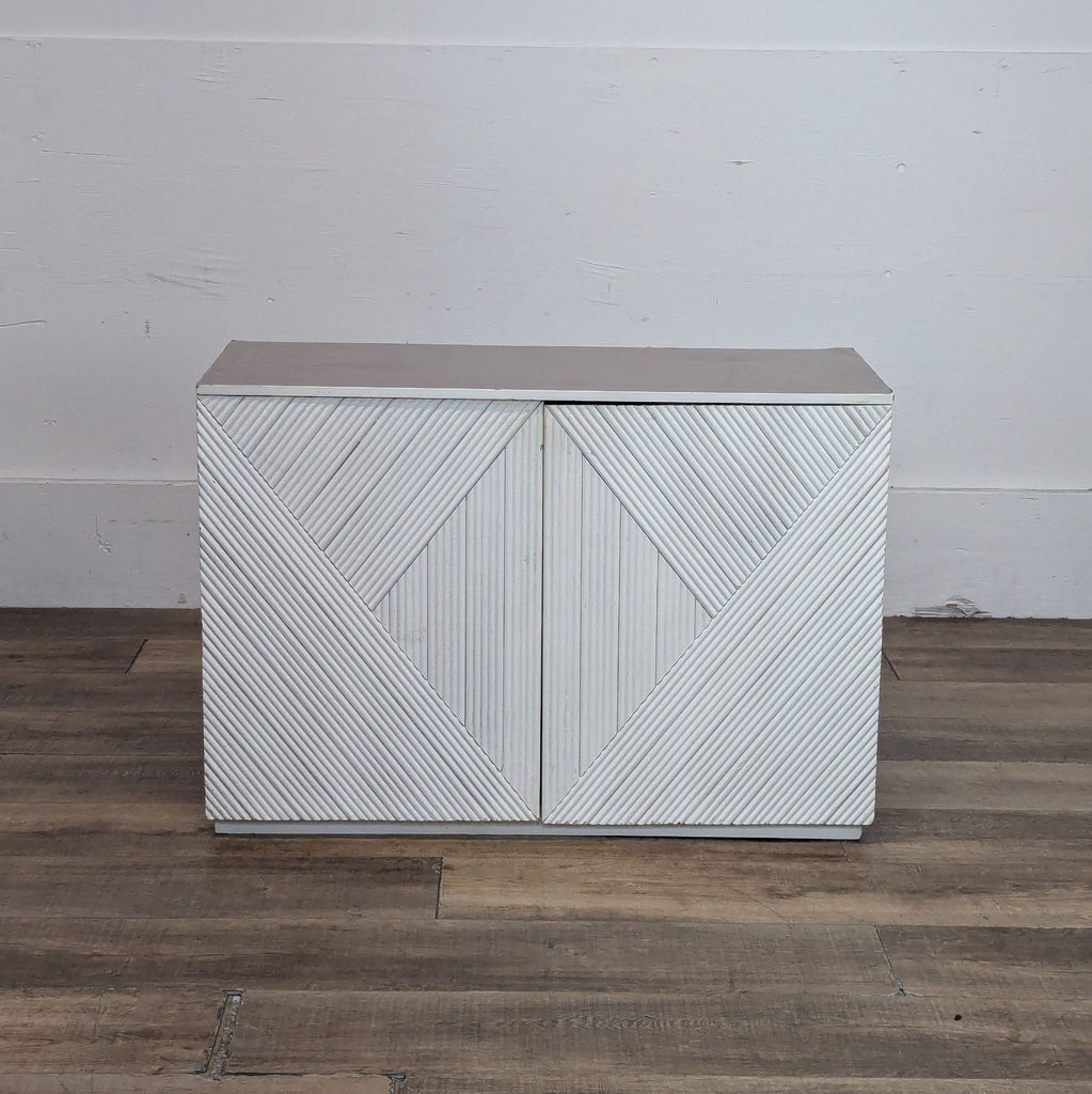 Halsey cabinet with geometric design, viewed from the front with closed doors.