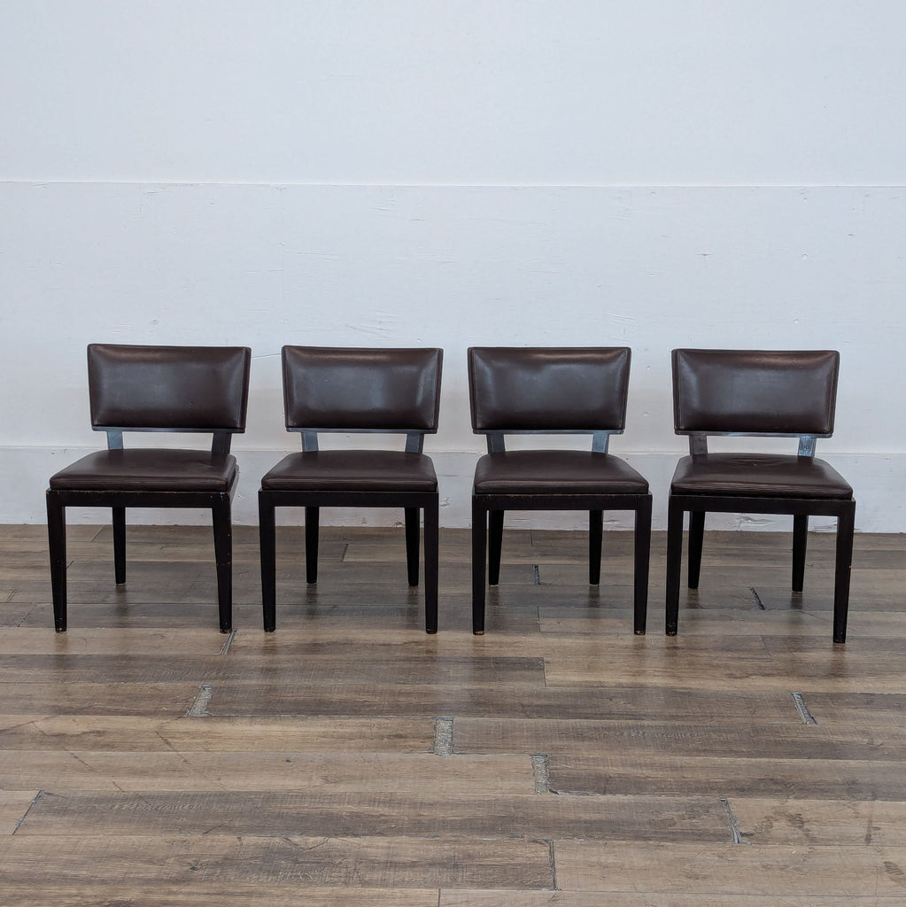 1. Set of four Harry dining chairs in dark wood and brown leather by Holly Hunt/Christian Liaigre, front view.