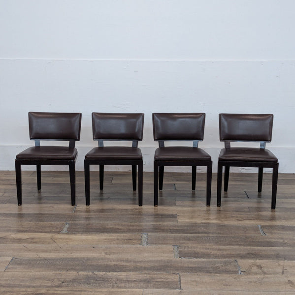 1. Set of four Harry dining chairs in dark wood and brown leather by Holly Hunt/Christian Liaigre, front view.