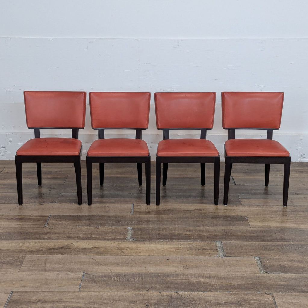 1. Set of four Harry dining chairs by Holly Hunt/Christian Liaigre, featuring red Spinneybeck leather and dark wood.