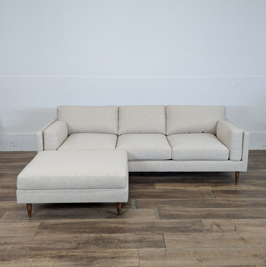 1. Modern sectional sofa by BenchMade Modern with Merrick fabric, thin frame, plush cushions, and walnut tapered legs.