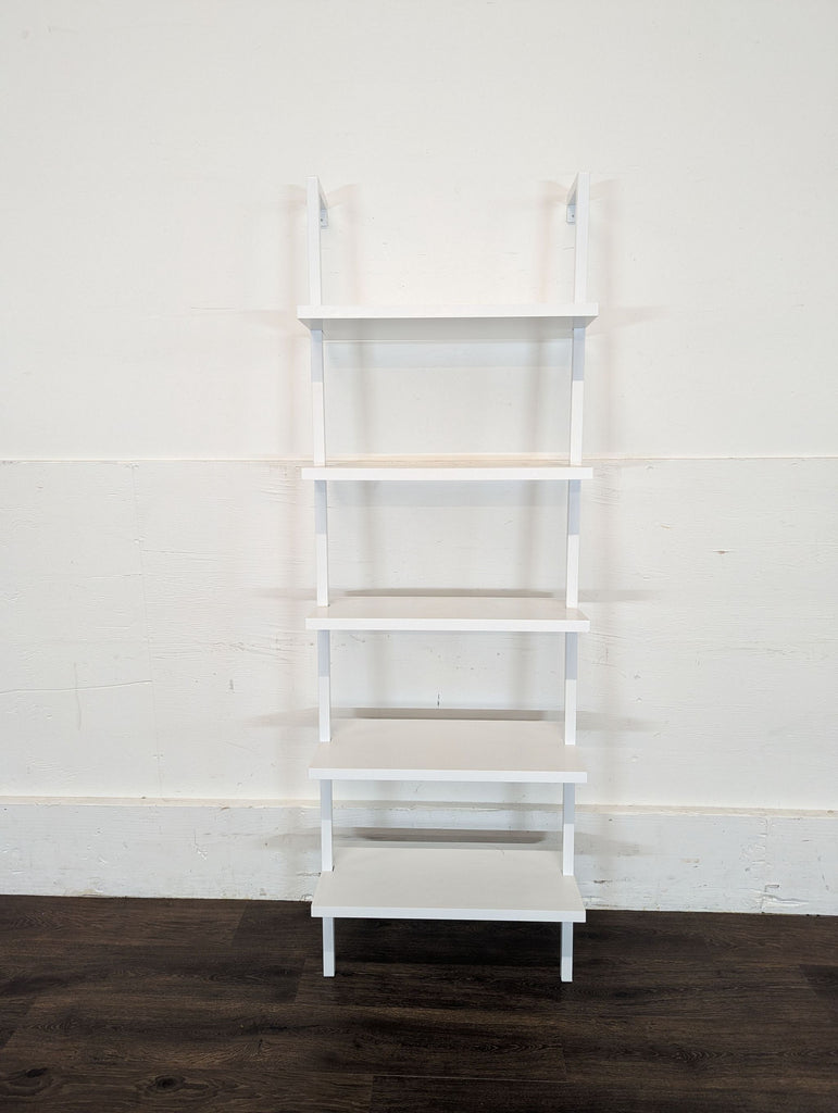 2. Empty Nathan James Theo 73" 5-Shelf ladder bookcase in white, shown against a plain wall on dark flooring.