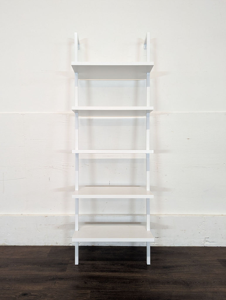 3. Front view of the Nathan James Theo 73" 5-Shelf white ladder bookshelf, unoccupied, for books or decor.