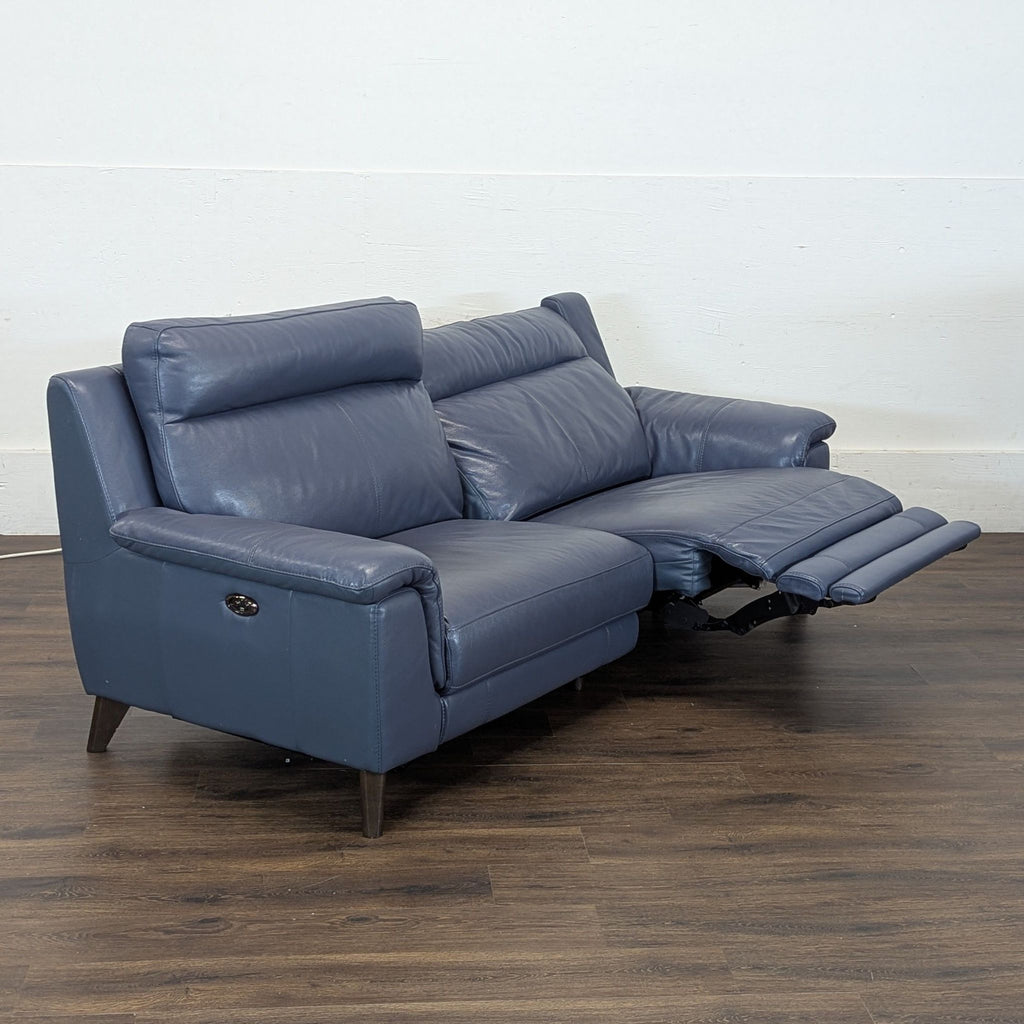 Couch is electric and each side reclines with button on sides to almost flat.
7ft x 3 ft