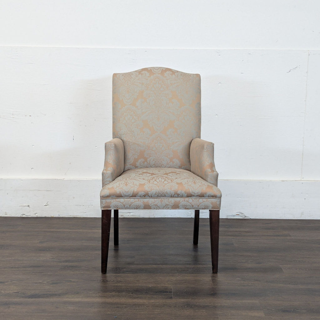 1. Reperch upholstered armchair with high back, damask pattern, and wooden legs, shown from the front.