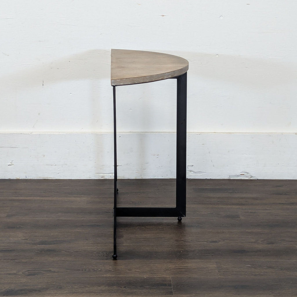 3. Reperch brand half-circle console table with minimalist black frame, viewed from the side.