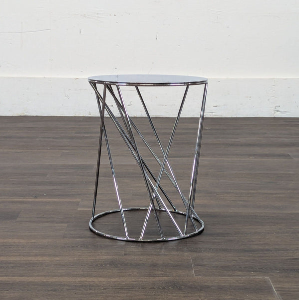 1. Modern Reperch end table with round mirrored top and crisscross chrome metal base on wood floor.