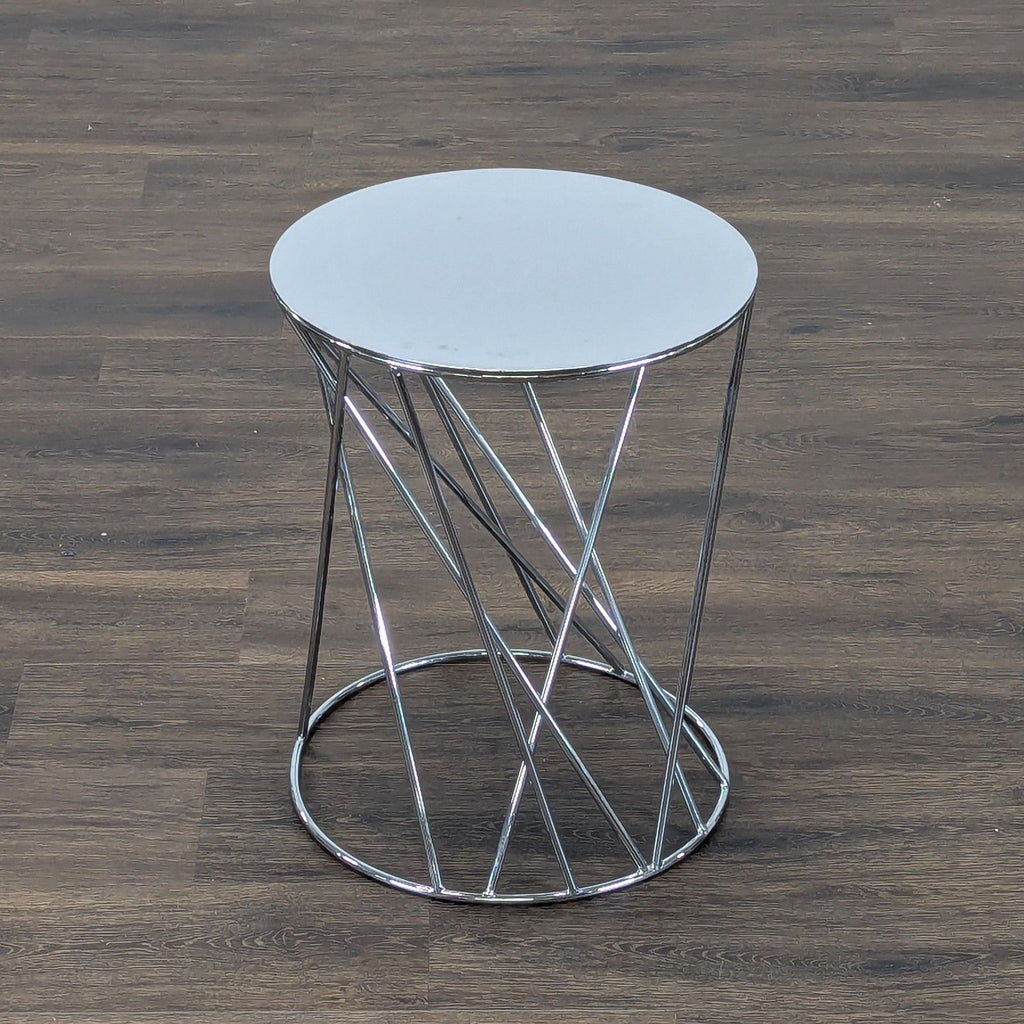 2. Sleek Reperch metallic end table featuring circular mirrored surface and geometric tubular base design.