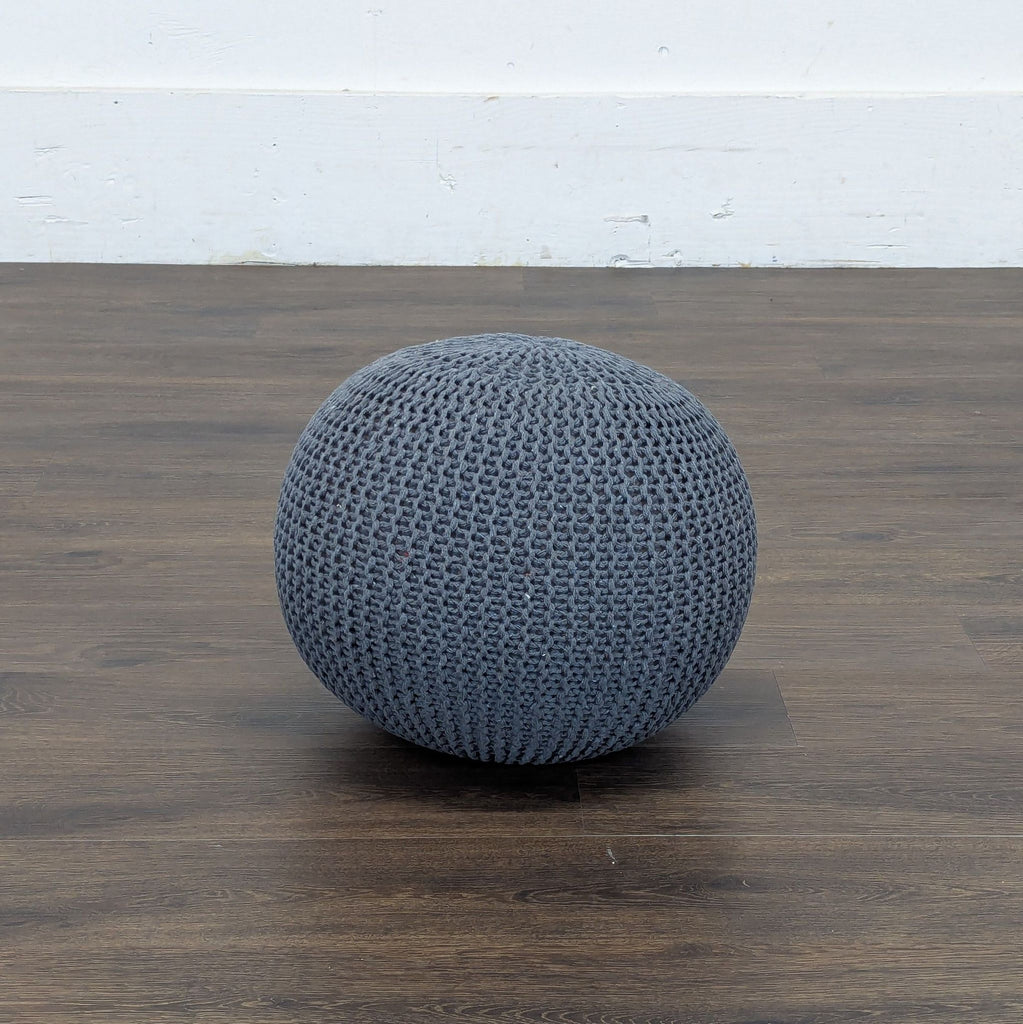 2. Reperch brand spherical pouf in textured gray knit, perfect as a stool or footrest in living spaces.