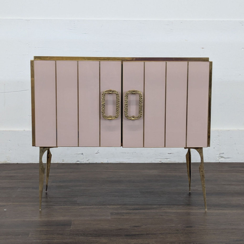 2. Pink and gold console table by Vintage Italian, featuring textured handles and slim metal legs on wood floor.